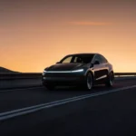 Tesla Model Y with futuristic city skyline at sunset, highlighting EV tax credit deadline and price increase news